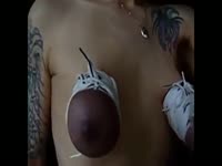 Busty MILF torturing her tits